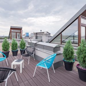 Beyond initial construction, what additional services do we offer for rooftop patios?