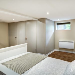 How can one maximize natural light in a basement renovation?