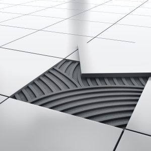 Should I choose hardwood or tile flooring for my kitchen renovation?